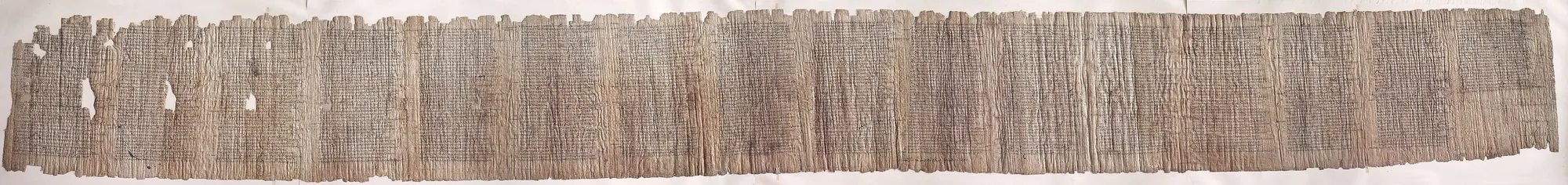 A second-century papyrus of the Iliad, unrolled: columns of Greek
                capitals with a reader's own marks in the margins.